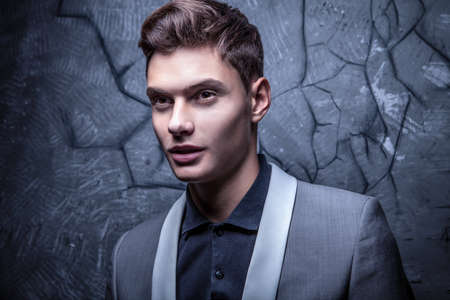 Elegant young handsome man  Studio fashion portrait  の写真素材