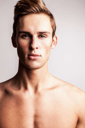 Elegant young handsome man  Studio fashion portrait  の写真素材