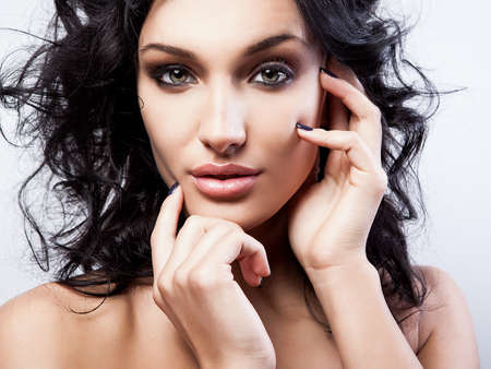 Portrait of a young beauty  Close-up Photo  