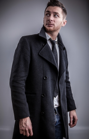 Elegant young handsome man  Studio fashion portrait  の写真素材