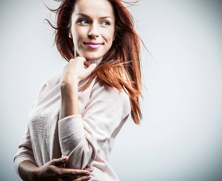Attractive red hair woman  Studio portrait  