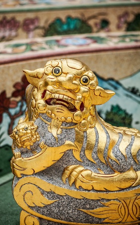Traditional asian image cut from stone on a wall の写真素材
