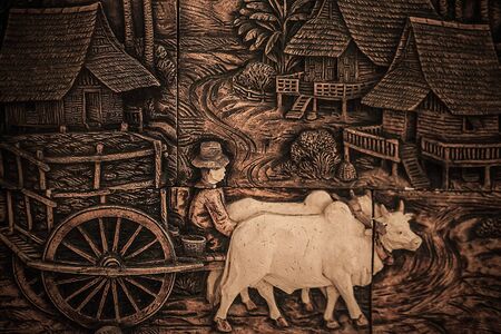 Traditional asian image cut from stone on a wall のeditorial素材