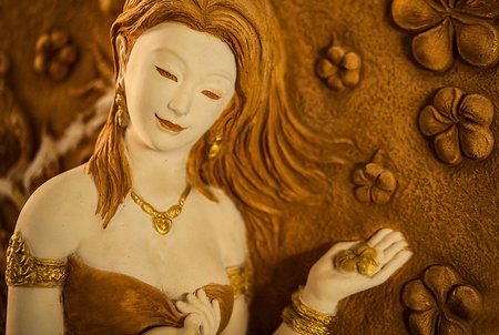 Traditional asian image cut from stone on a wall のeditorial素材