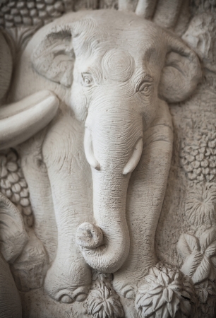 Traditional asian image cut from stone on a wall のeditorial素材