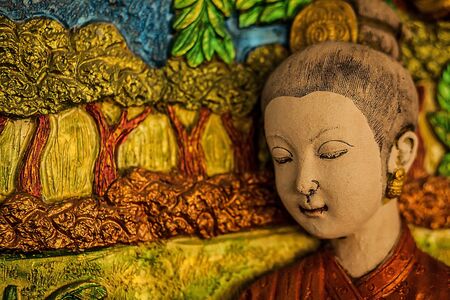 Traditional asian image cut from stone on a wall のeditorial素材
