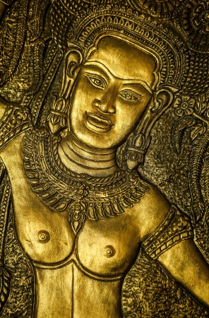 Traditional asian image cut from stone on a wall のeditorial素材