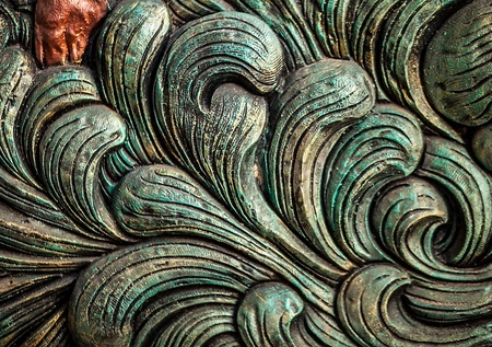 Traditional asian image cut from stone on a wall の写真素材