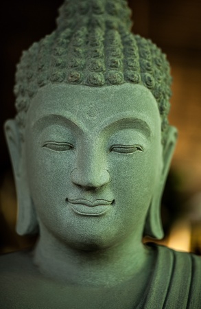 Traditional Asian statue from a stone の写真素材