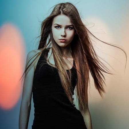 Young sensual model girl  Color face art studio photo の写真素材