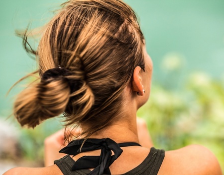 Beautiful young woman on the rockの写真素材