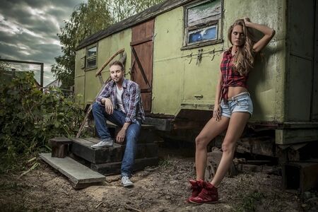 Positive young couple spending time outdoors   