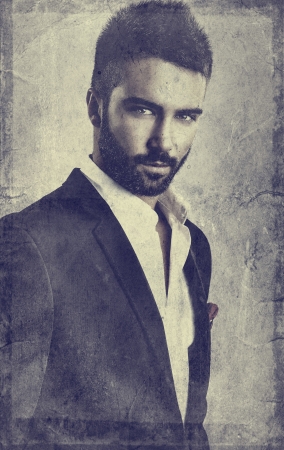 Retro styled grunge portrait of young attractive man の写真素材