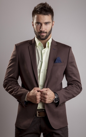 Elegant young handsome man  Studio fashion portrait   の写真素材