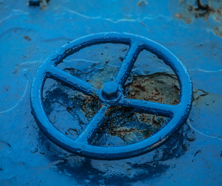 Old blue faucetの写真素材