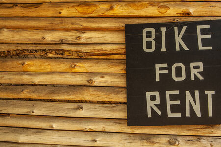  Bike for rent  - wooden with copy space の写真素材