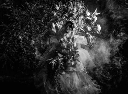Fashion image of sensual girl in bright fantasy stylization  Black-white outdoor fairy tale art photo の写真素材