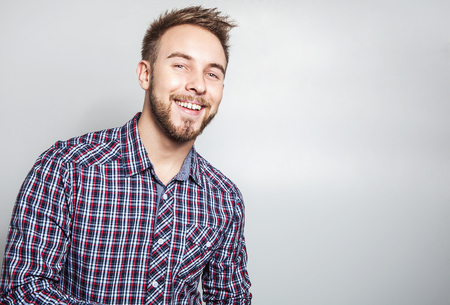 Elegant & positive young handsome man. Studio fashion portrait.の写真素材