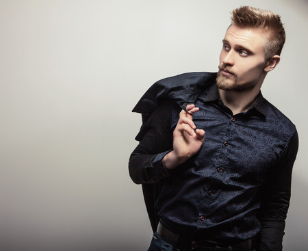 Elegant young handsome man in shirt. Studio fashion portrait.の写真素材