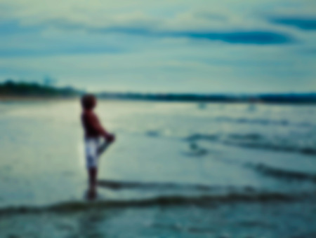 Men and ocean. Blurred photo background.の写真素材