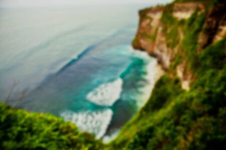 Beautiful blurred tropical view in defocus. Landscape photo with rocks and sea.の写真素材