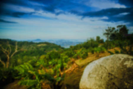Beautiful blurred tropical view in defocus. Landscape photo with rocks and sea.の写真素材
