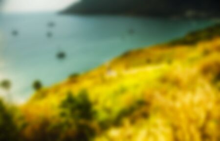 Beautiful blurred tropical view in defocus. Landscape photo with rocks and sea.