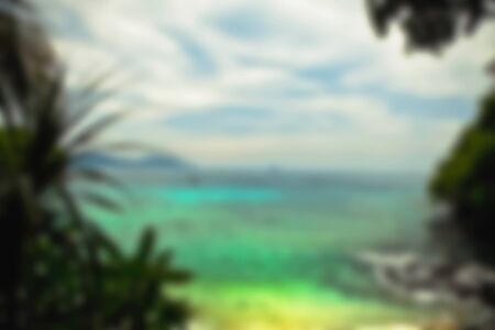 Beautiful blurred tropical view in defocus. Landscape photo with rocks and sea.の写真素材
