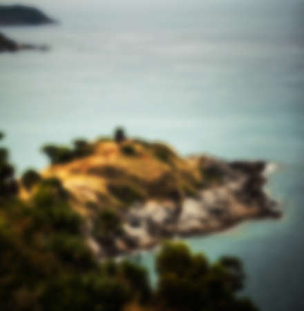 Beautiful blurred tropical view in defocus. Landscape photo with rocks and sea.の写真素材