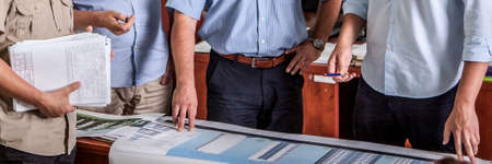 Panoramic view group of business people at work. Close-up employers hands.の写真素材