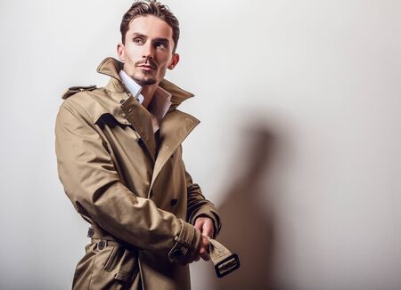 Elegant man in long stylish coatの写真素材