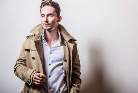 Elegant man in long stylish coatの写真素材