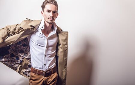 Elegant man in long stylish coatの写真素材