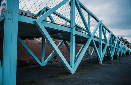 Modern Bridge near city beach in Hague, evening time.