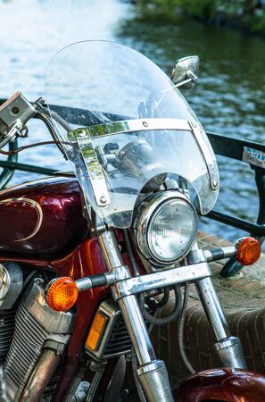 Old motorcycle on street close-up.の写真素材