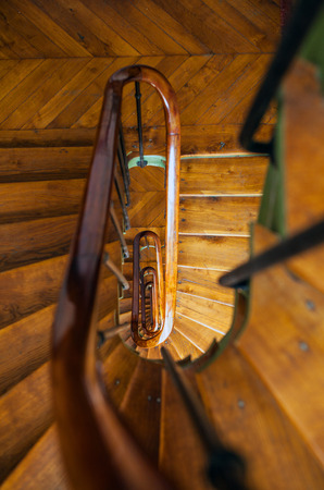 Wooden spiral staircase in old building, Paris, France.の写真素材