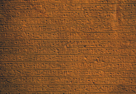 Ancient Egyptian art relief on stone as background.