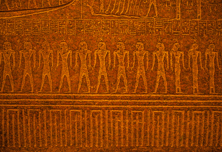 Ancient Egyptian art relief on stone as background.