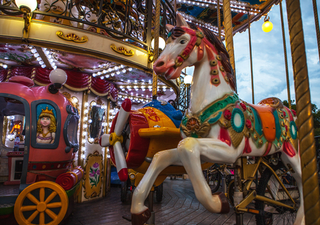 PARIS, FRANCE - AUGUST 30, 2015: Old French carousel in a holiday park at night summer time.のeditorial素材