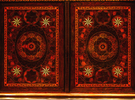 Old wooden ornaments as background.