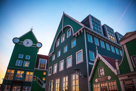 ZAANDAM, NETHERLANDS - MARCH 18, 2016: Inntel hotel at twilight time. Opened in 2009, design attracts guests by incorporating traditional architecture of Zaan region on 18 March in Zaandam, Holland.のeditorial素材