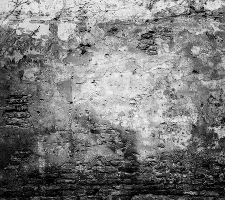 Background of old vintage brick wall. Black-white photo.の写真素材