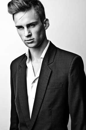 Elegant stylish handsome man. Black-white studio fashion portrait.の写真素材
