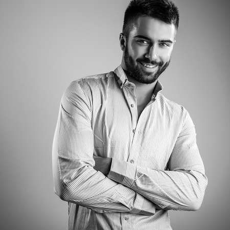 Elegant young handsome man. Black-white studio fashion portrait.の写真素材