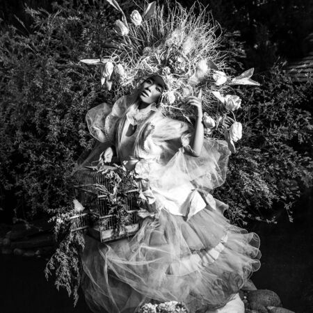 Dramatized image of sensual girl symbolizing nature. Black-white art fashion outdoor photo.