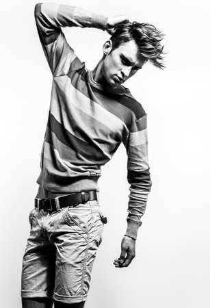 Elegant stylish handsome man. Black-white studio fashion portrait.の写真素材