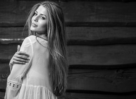 Young sensual & beauty blonde woman pose on wooden background.の写真素材