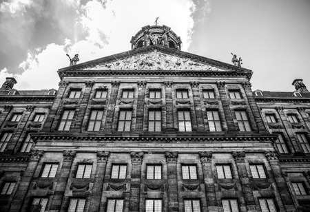 AMSTERDAM, NETHERLANDS - AUGUST 6, 2016: Famous buildings of Amsterdam city centre close-up. General landscape view of city streets and traditional Dutch architecture. Amsterdam - Netherlands.のeditorial素材