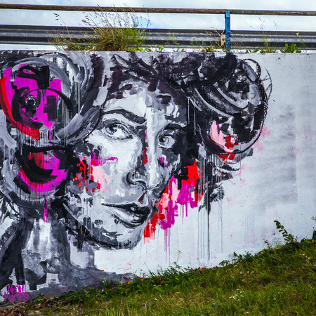 AMSTERDAM, NETHERLANDS - AUGUST 15, 2016: Art image of face on street wall. Amsterdam - Netherlands.のeditorial素材