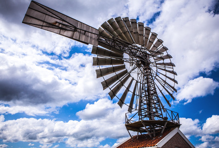 Dutch windmills with dramatic cloudy sky close-up.の写真素材